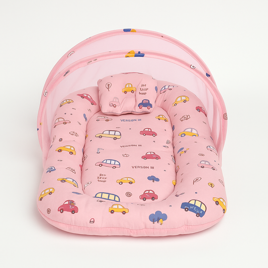 Mosquito net baby bed in pink car print for safe and cozy sleep

